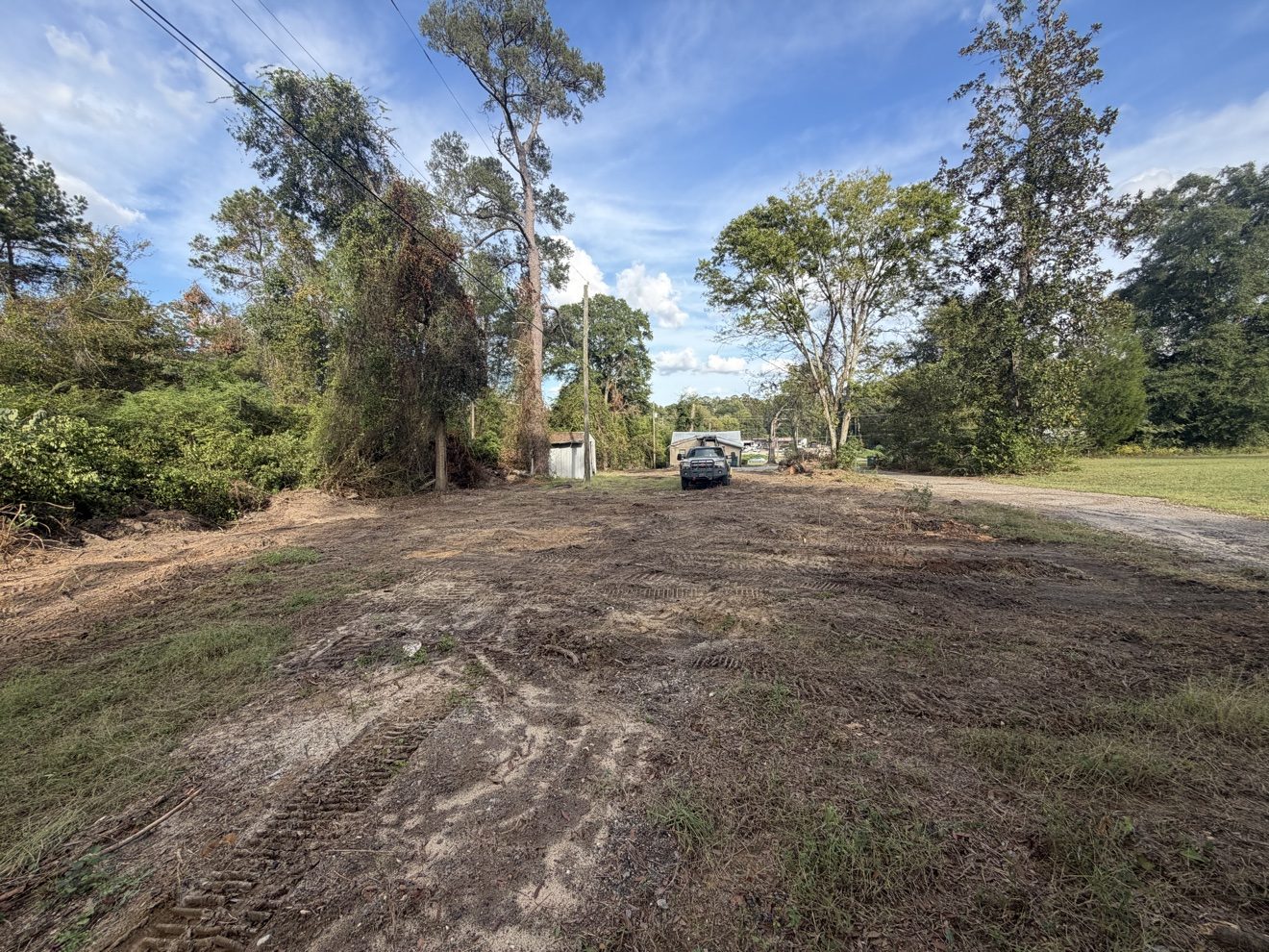 Wide cleared access road after cleanup